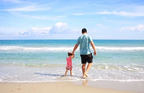father-daughter-beach-sea-38302.jpeg